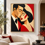 Red and black geometric couple canvas wall art in a natural wood frame above a neutral sofa