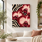 Red orchids on a zebra stripe background as unframed canvas wall art above a sofa