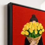 Woman holding tulips canvas wall art black frame close-up