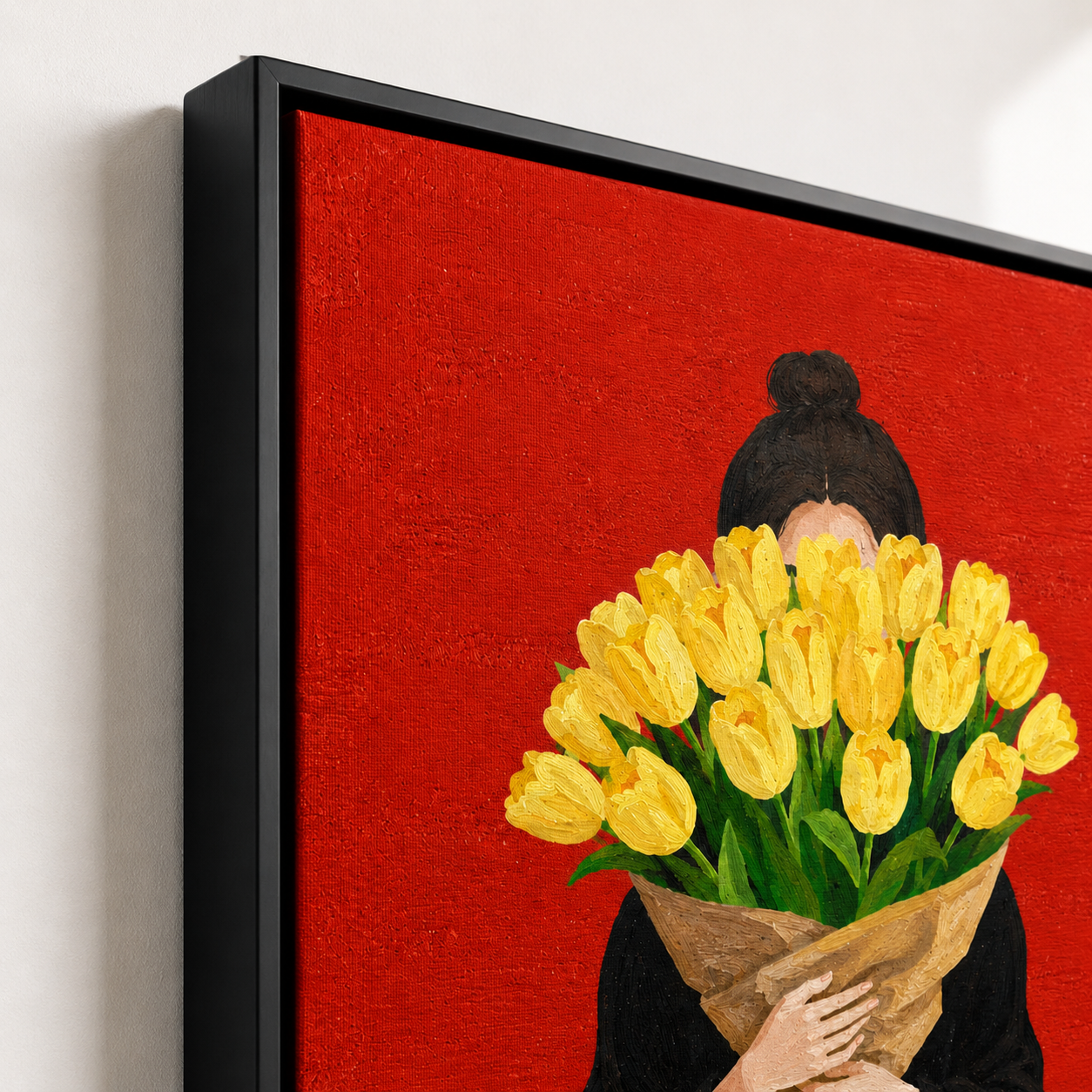 Woman holding tulips canvas wall art black frame close-up