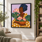 Woman with pink lotus flowers canvas wall art in a black frame beside a reading chair