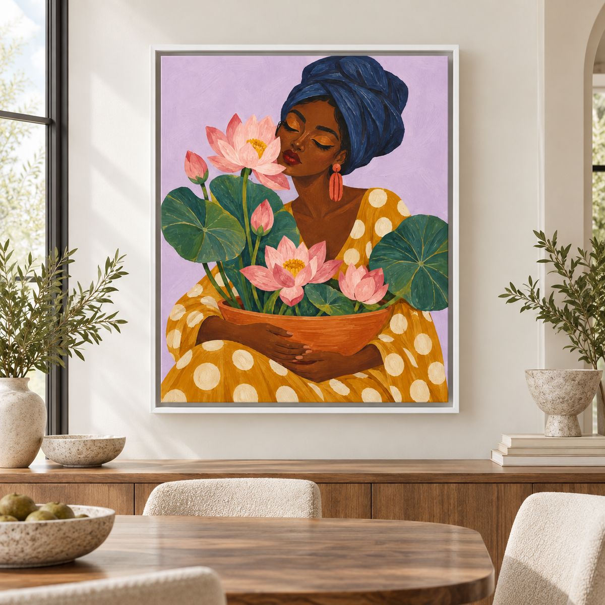 Woman with pink lotus flowers canvas wall art in a white frame above a dining room sideboard